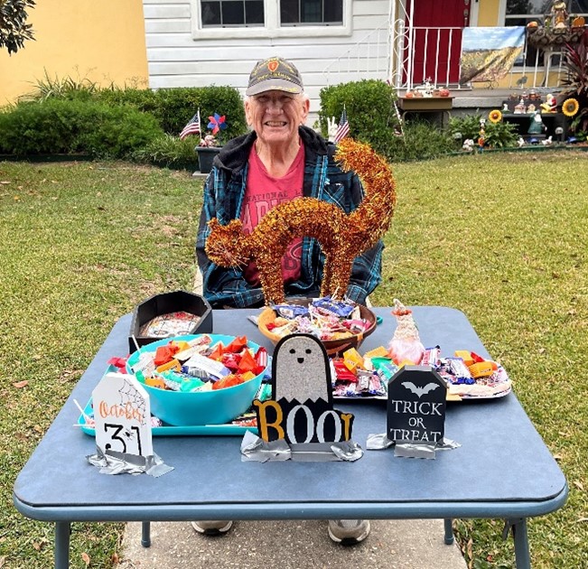 image of David Devaney sitting at a table with Holloween treats.